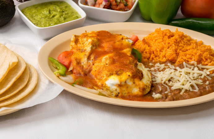 Breakfast plate with a side of rice and beans